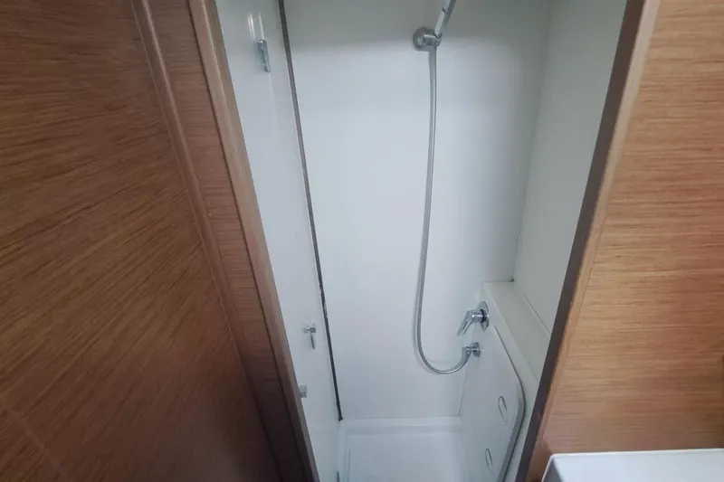  Yacht Photos Pics Compact shower area in 2020 Lagoon 42 catamaran with wooden paneling.