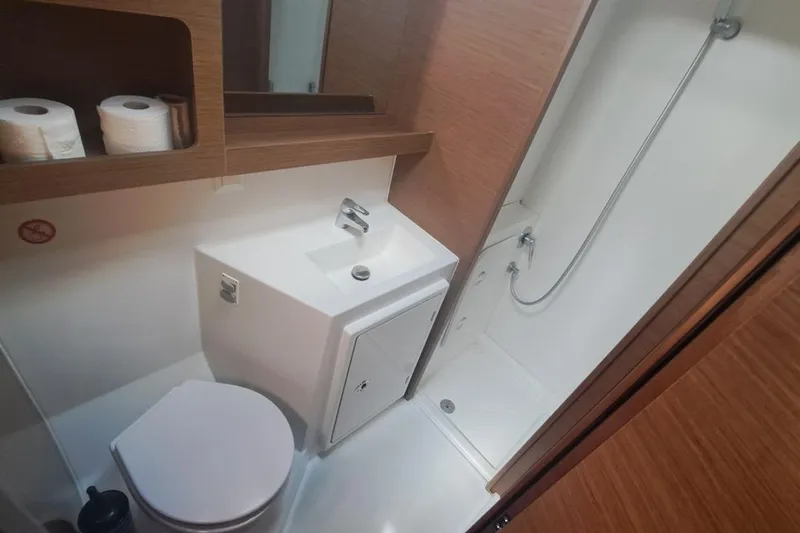  Yacht Photos Pics Bathroom interior of 2020 Lagoon 42 yacht with shower, sink, and toilet.