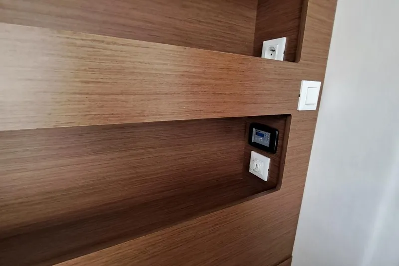  Yacht Photos Pics Wooden interior panel with switches and controls on a 2020 Lagoon 42 yacht.