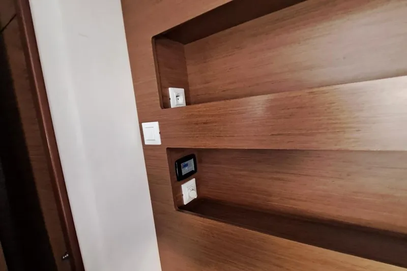  Yacht Photos Pics Wooden interior panel with electrical outlets on a 2020 Lagoon 42 yacht.