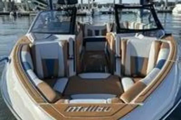  Yacht Photos Pics 2023 Malibu Wakesetter 23 LSV boat with stylish interior at a marina.