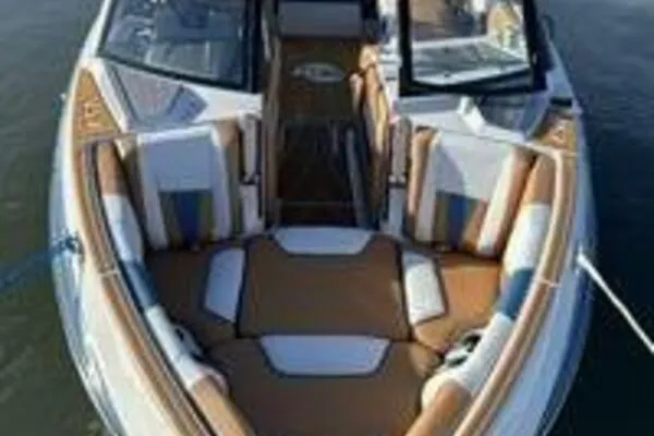  Yacht Photos Pics 2023 Malibu Wakesetter 23 LSV boat with luxurious seating on calm water.