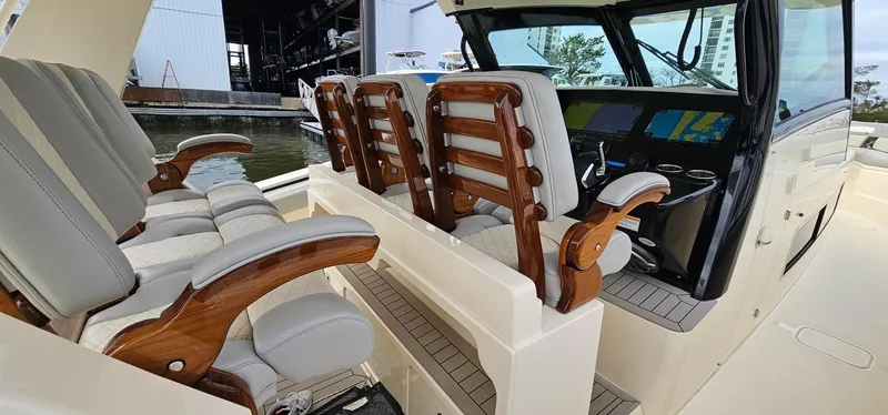  Yacht Photos Pics 2023 Scout 425 LXF boat interior with luxurious seating and modern dashboard.