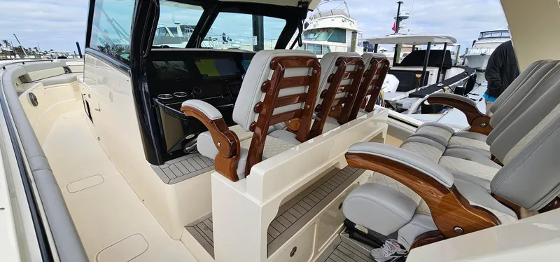  Yacht Photos Pics 2023 Scout 425 LXF luxury boat interior with elegant seating and modern dashboard.
