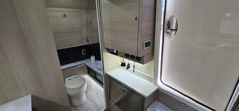  Yacht Photos Pics Luxurious 2023 Scout 425 LXF boat interior with modern bathroom amenities.