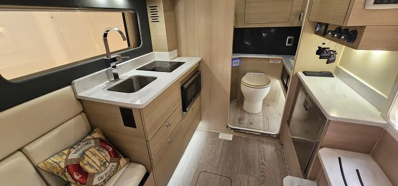  Yacht Photos Pics Luxurious 2023 Scout 425 LXF interior with modern kitchen and bathroom amenities.