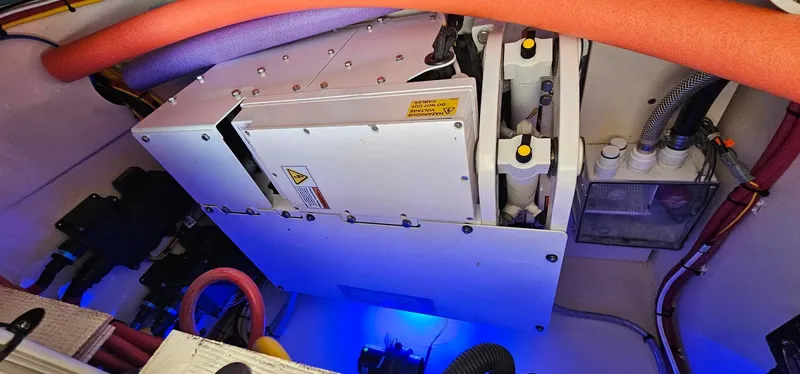  Yacht Photos Pics Engine compartment of 2023 Scout 425 LXF boat with advanced machinery and wiring.