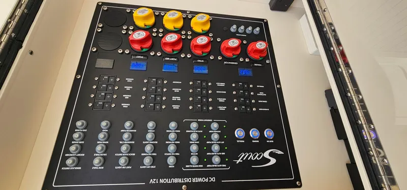  Yacht Photos Pics Control panel of 2023 Scout 425 LXF boat with switches and indicators.