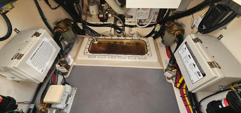  Yacht Photos Pics Engine compartment of 2023 Scout 425 LXF boat, showcasing wiring and components.