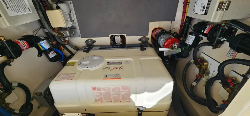  Yacht Photos Pics Engine room of 2023 Scout 425 LXF boat with equipment and wiring.