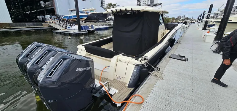  Yacht Photos Pics 2023 Scout 425 LXF boat docked with triple Mercury engines.