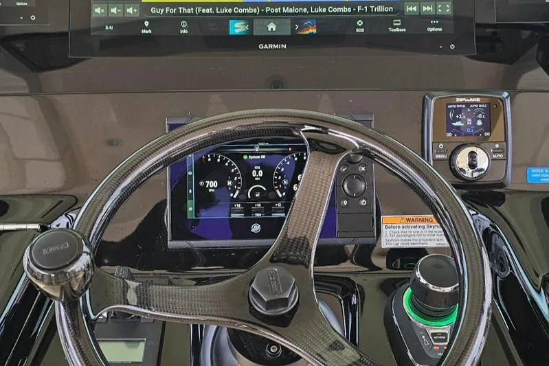  Yacht Photos Pics 2023 Scout 425 LXF dashboard with steering wheel and digital displays.