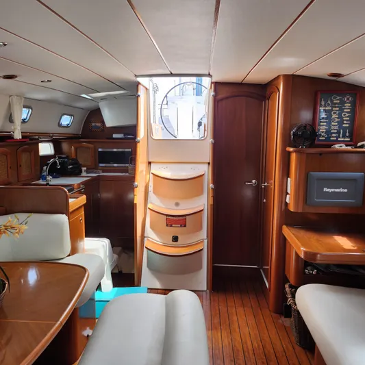 Scot-free Yacht Photos Pics Interior of 1999 Beneteau Oceanis 461 yacht with wood finish and modern amenities.