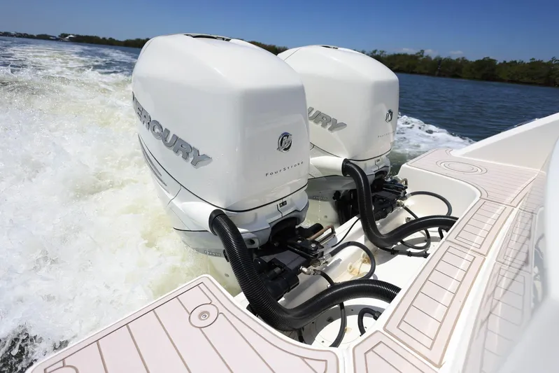  Yacht Photos Pics 2019 Boston Whaler 330 Outrage with dual Mercury outboard engines on water.