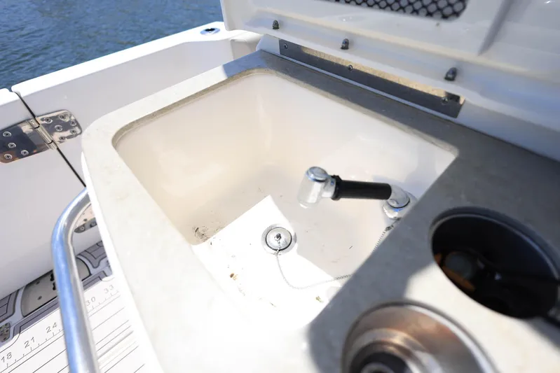  Yacht Photos Pics Boston Whaler 330 Outrage 2019 boat sink and faucet detail.