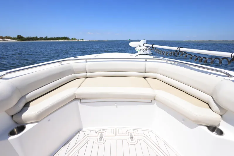  Yacht Photos Pics 2019 Boston Whaler 330 Outrage boat interior with cushioned seating, ocean view.