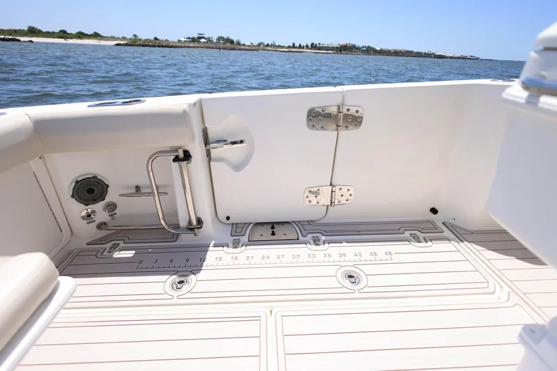  Yacht Photos Pics 2019 Boston Whaler 330 Outrage boat deck with ocean view in background.