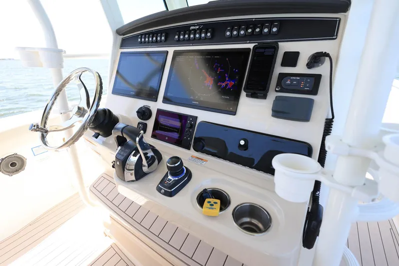  Yacht Photos Pics 2019 Boston Whaler 330 Outrage helm with advanced navigation and control systems.