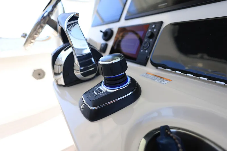  Yacht Photos Pics Control panel of 2019 Boston Whaler 330 Outrage boat, featuring joystick and throttle.