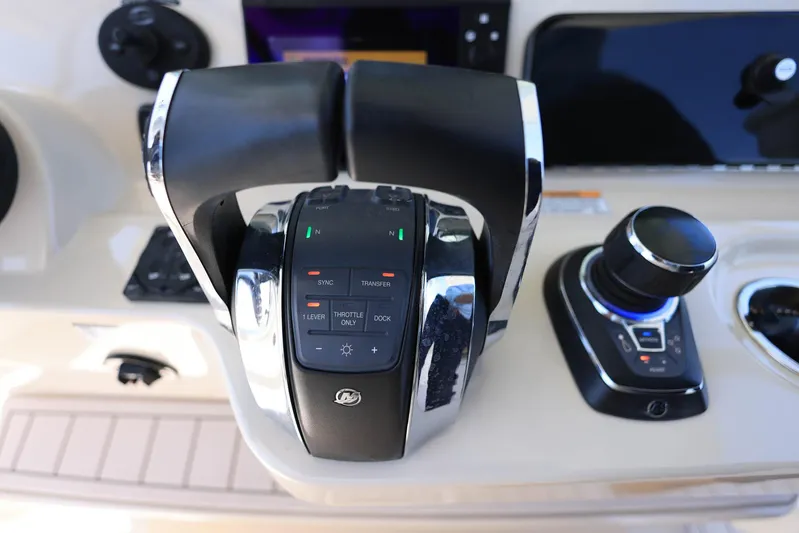  Yacht Photos Pics 2019 Boston Whaler 330 Outrage throttle and control panel, featuring modern navigation technology.