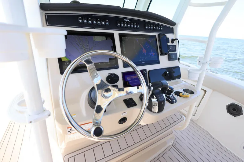  Yacht Photos Pics 2019 Boston Whaler 330 Outrage helm with advanced navigation and control systems.
