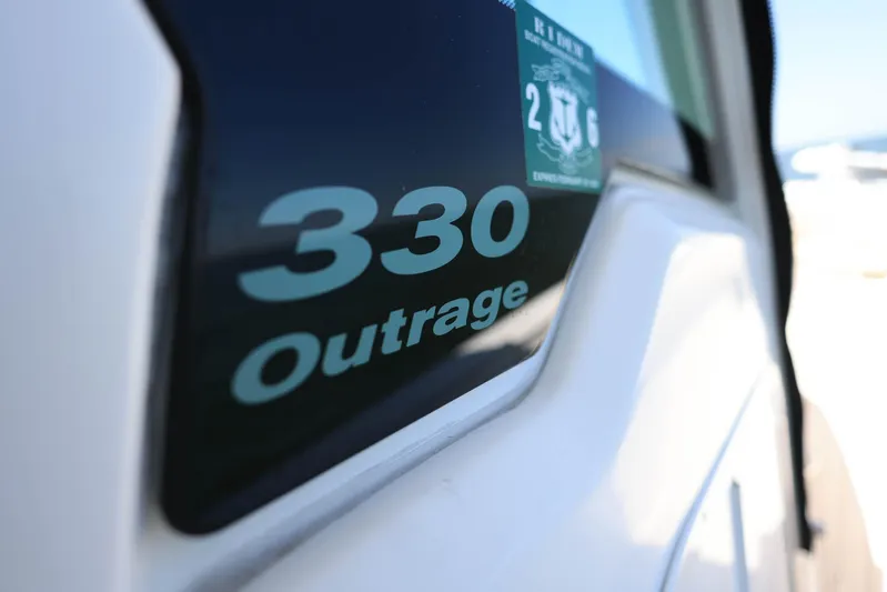  Yacht Photos Pics Boston Whaler 330 Outrage 2019 model nameplate on boat exterior.
