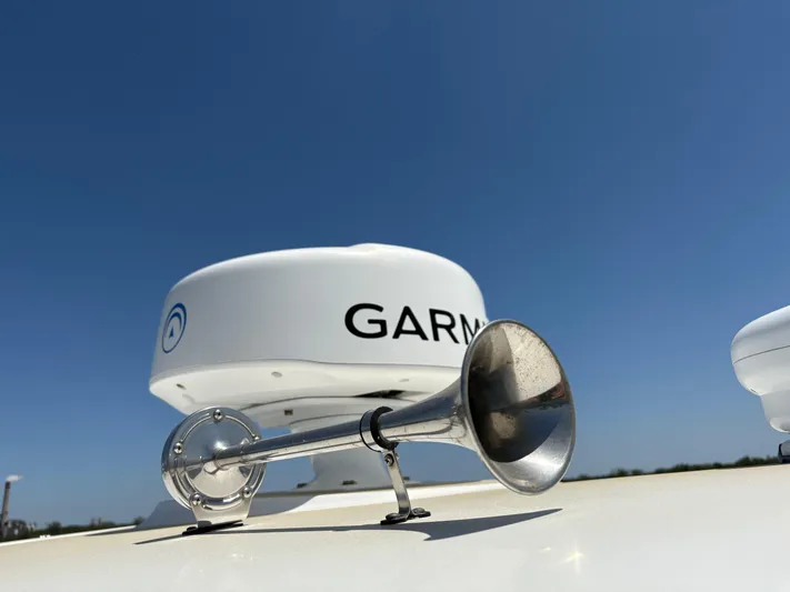  Yacht Photos Pics Horn and Garmin radar on 2019 Boston Whaler 330 Outrage boat under clear blue sky.