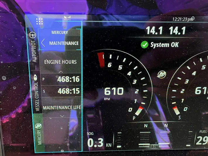  Yacht Photos Pics Dashboard of a 2019 Boston Whaler 330 Outrage showing engine hours and system status.