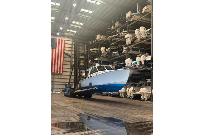 American Girl Yacht Photos Pics 2021 Back Cove 390 boat in storage facility with American flag.