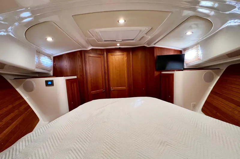 American Girl Yacht Photos Pics Luxurious cabin interior of 2021 Back Cove 390 yacht with wood paneling and TV.