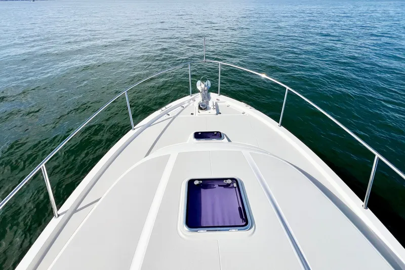 American Girl Yacht Photos Pics Bow view of 2021 Back Cove 390 yacht on calm water.