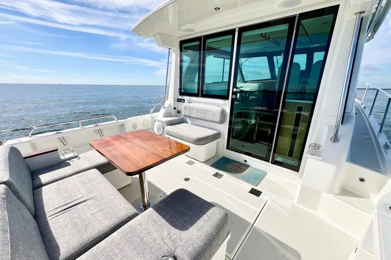 American Girl Yacht Photos Pics 2021 Back Cove 390 yacht with spacious deck, comfortable seating, and ocean view.