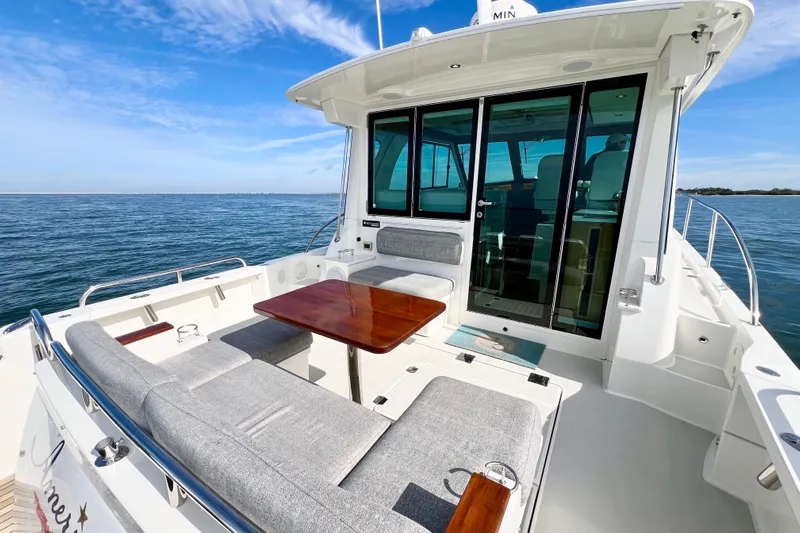 American Girl Yacht Photos Pics 2021 Back Cove 390 yacht with spacious deck seating and ocean view.