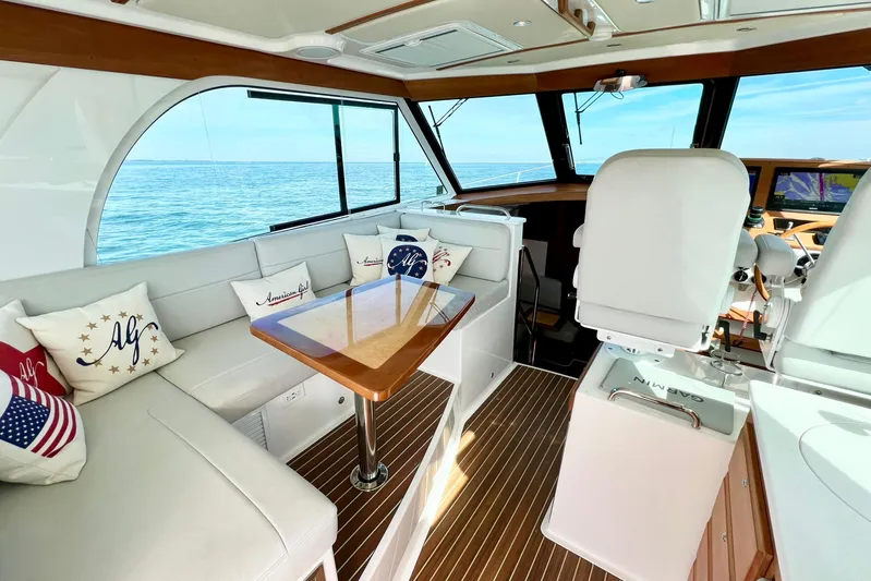 American Girl Yacht Photos Pics Luxurious interior of 2021 Back Cove 390 yacht with elegant seating and ocean view.