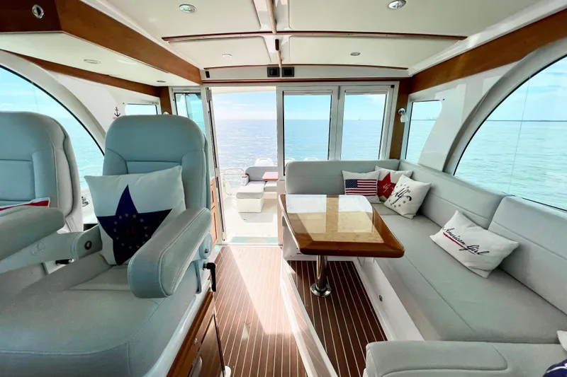 American Girl Yacht Photos Pics Luxurious interior of 2021 Back Cove 390 yacht with ocean view and elegant seating.