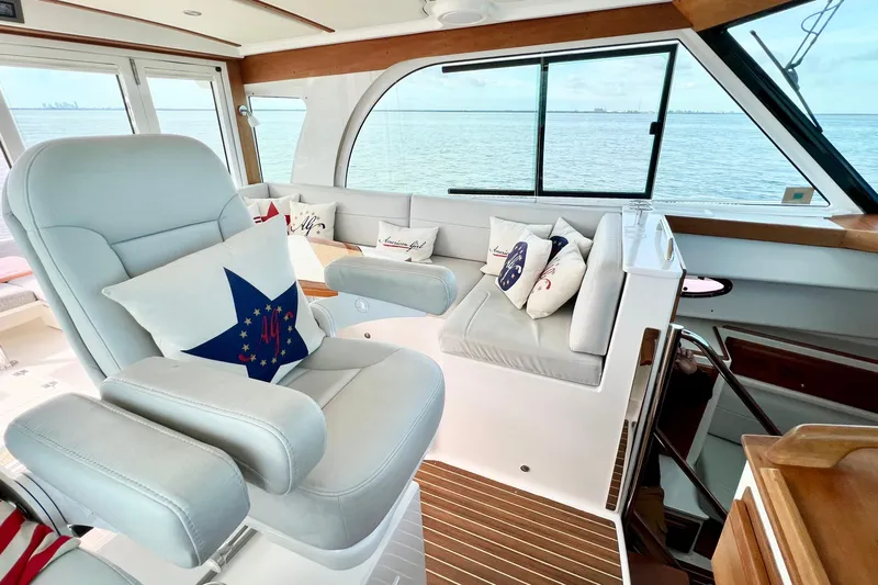American Girl Yacht Photos Pics Luxurious interior of 2021 Back Cove 390 yacht with plush seating and nautical decor.