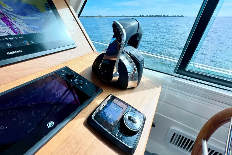 American Girl Yacht Photos Pics 2021 Back Cove 390 helm with Garmin navigation, joystick control, and ocean view.