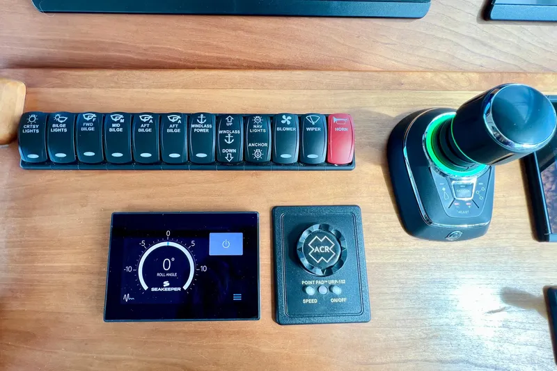 American Girl Yacht Photos Pics Control panel of a 2021 Back Cove 390 boat with switches and joystick.