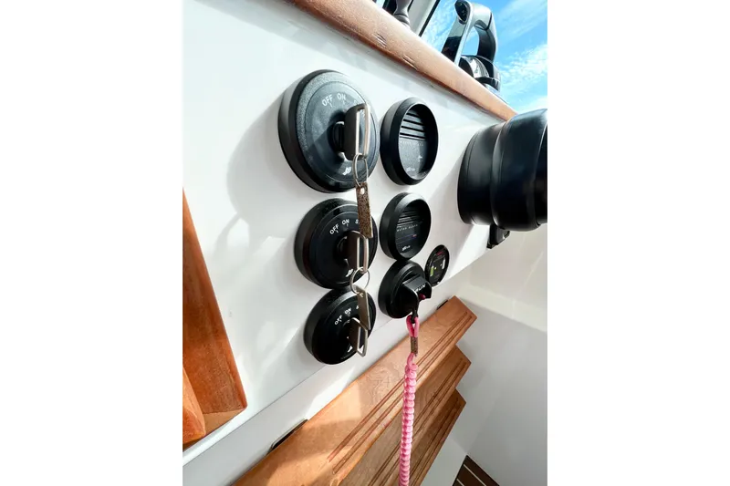 American Girl Yacht Photos Pics Control panel of 2021 Back Cove 390 boat with switches and gauges.