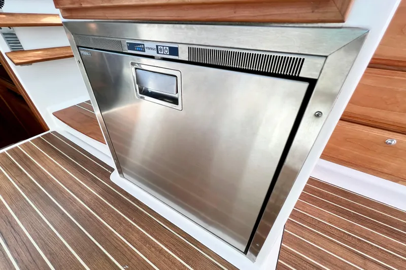 American Girl Yacht Photos Pics Stainless steel appliance on 2021 Back Cove 390 yacht with wooden flooring.