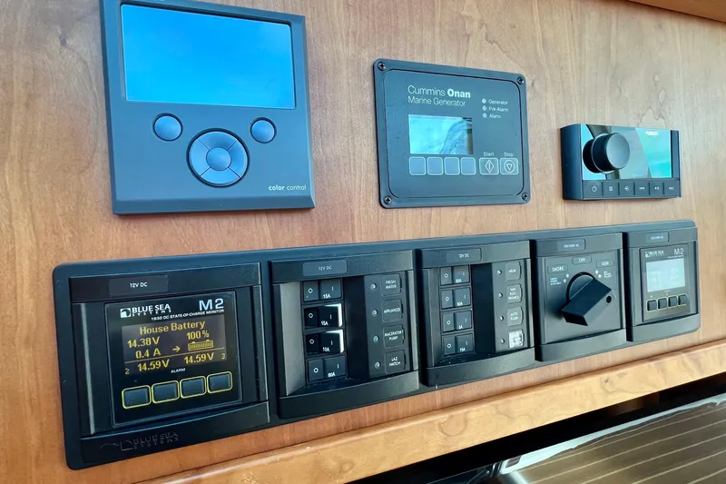 American Girl Yacht Photos Pics Control panel of a 2021 Back Cove 390 boat with various electronic displays and switches.