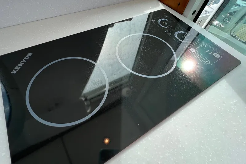 American Girl Yacht Photos Pics Kenyon electric cooktop on 2021 Back Cove 390 yacht, featuring sleek black design.