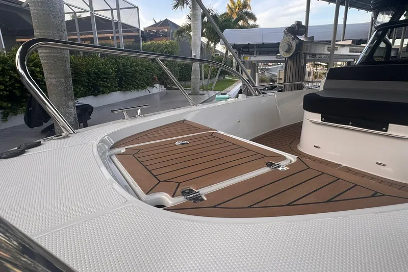  Yacht Photos Pics 2021 Nimbus T9 boat deck with teak flooring and stainless steel railings.