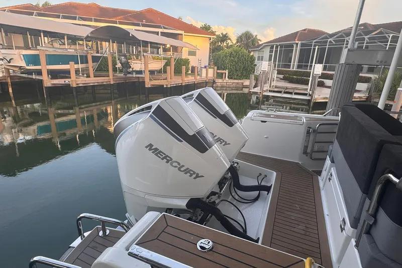  Yacht Photos Pics Nimbus T9 boat with dual Mercury outboard engines docked in a marina.
