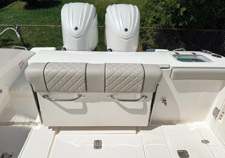  Yacht Photos Pics 2024 Pursuit S 288 Sport boat with dual engines and cushioned seating.