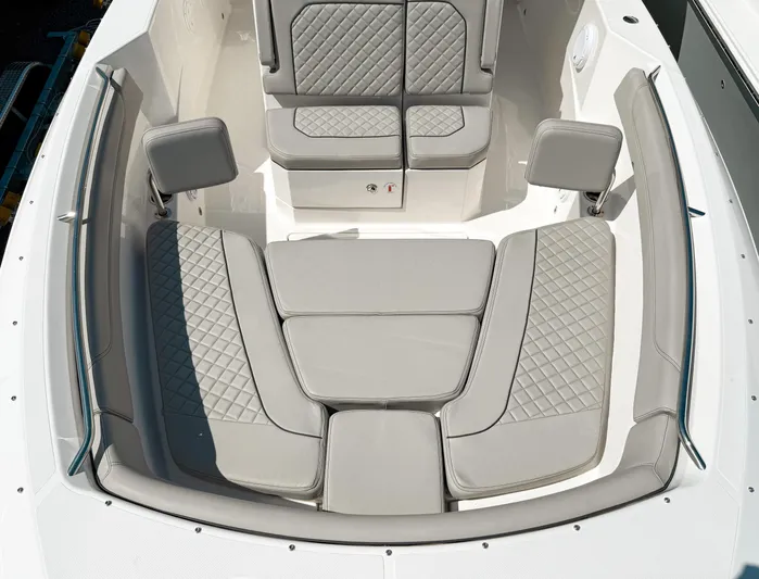  Yacht Photos Pics 2024 Pursuit S 288 Sport boat interior with luxurious seating and quilted upholstery.
