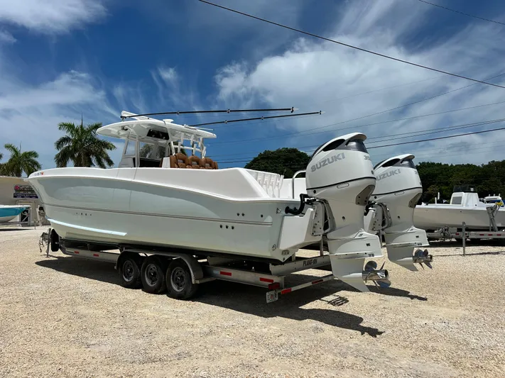  Yacht Photos Pics 2023 Twin Vee 340 GFX CC boat with dual Suzuki engines on a trailer.