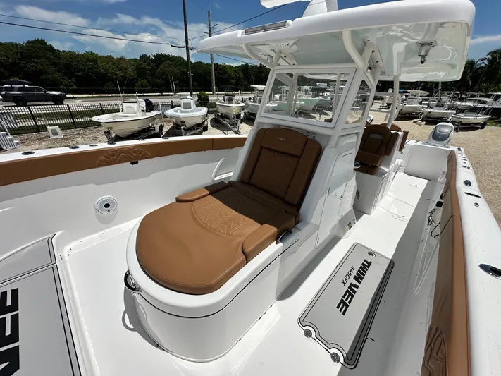  Yacht Photos Pics 2023 Twin Vee 340 GFX CC boat with brown seating and white deck.