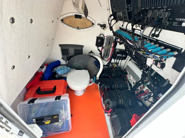  Yacht Photos Pics Interior of 2023 Twin Vee 340 GFX CC boat, featuring storage, wiring, and a compact toilet.