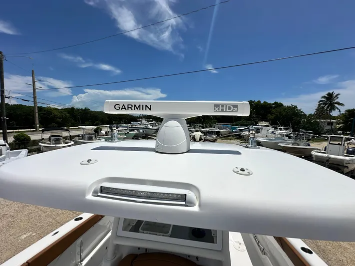  Yacht Photos Pics 2023 Twin Vee 340 GFX CC boat with Garmin xHD2 radar under clear blue sky.
